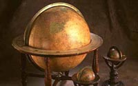 Composite photograph of two terrestrial globes and one celestial globe