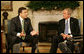 President George W. Bush listens as Mikhail Saakashvili offers remarks as they meet Wednesday, March 19, 2008, in the Oval Office of the White House. President Saakashvili expressed his gratitude for America's support, saying, "I have to thank you, Mr. President, for your unwavering support for our freedom, for our democracy, for our territorial sovereignty, and for protecting Georgia's borders, and for Georgia's NATO aspiration." White House photo by Joyce N. Boghosian