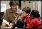 Laura Bush reads with children Wednesday, Jan. 26, 2006 during a visit to the kindergarten class at the Alice M. Harte Elementary School in New Orleans, La. White House photo by Shealah Craighead