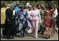 Laura Bush walks with members of the National Center for Women's Development in Abuja, Nigeria to the Women's Hall of Fame January 18, 2006. White House photo by Shealah Craighead