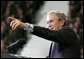 President George W. Bush takes one of many questions from an enthusiastic audience during his remarks on the War on Terror at Kansas State University in Manhattan, Kan., Monday, Jan. 23, 2006. White House photo by Eric Draper