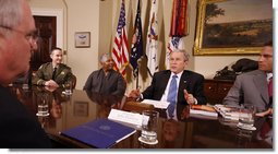 President George W. Bush speaks to participants during a meeting on drug use reduction Thursday, Dec. 11, 2008, in the Roosevelt Room of the White House. Listening in are, from left: Lt. Mike Boudreaux, Narcotics Commander, Tulare County Sheriff's Department, Visalia, Calif.; Janice Dessaso Gordon, co-founder, Community Action Group, Washington, D.C., and Josh Hamilton, outfielder with the Texas Rangers. John Walters, Director of the Office of National Drug Control Policy, is in foreground at left. White House photo by Chris Greenberg