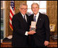 President George W. Bush stands with Chuck Colson after presenting him with the 2008 Presidential Citizens Medal Wednesday, Dec. 10, 2008, in the Oval Office of the White House. White House photo by Chris Greenberg