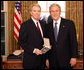 President George W. Bush stands with Dr. Don Landry after presenting him with the 2008 Presidential Citizens Medal Wednesday, Dec. 10, 2008, in the Oval Office of the White House. White House photo by Chris Greenberg