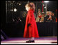 President George W. Bush and Mrs. Laura Bush watch four-year-old singer Kaitlyn Maher perform on the Ellipse Thursday, Dec. 4, 2008, prior to the Lighting of the National Christmas Tree in Washington, D.C. White House photo by Eric Draper