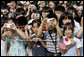 President George W. Bush and Prime Minister Junichiro Koizumi of Japan are greeted by an enthusiastic crowd of young guests during an arrival ceremony on the South Lawn Thursday, June 29, 2006. White House photo by Eric Draper