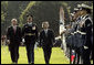 President George W. Bush and Prime Minister Junichiro Koizumi of Japan review the troops during an arrival ceremony on the South Lawn Thursday, June 29, 2006. "Japan is now the third largest donor nation for reconstruction efforts in Afghanistan," said President Bush in his address. "In Iraq, Japanese self-defense forces have helped improve the lives of citizens in a key Iraqi province that will soon return to Iraqi control." White House photo by Paul Morse