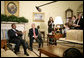 President George W. Bush and President Denis Sassou-Nguesso of the Republic of the Congo talk with the press during a meeting in the Oval Office Monday, June 5, 2006. "We had a very constructive discussion about a variety of issues," said President Bush. "We talked about our common commitment to help end the genocide in Darfur. I appreciate the President's leadership in helping negotiate a peace agreement, and I appreciate his leadership in working with the United Nations so we can get the AU forces blue-helmeted as quickly as possible." White House photo by Eric Draper