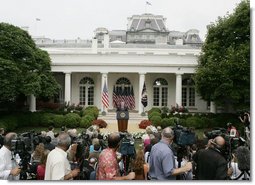 President George W. Bush talks with members of the media Wednesday morning, June 14, 2006, during a news conference in the Rose Garden, following his trip to Iraq where he met with members of the Iraq government and U.S. troops. White House photo by Kimberlee Hewitt