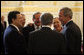 President George W. Bush looks at Austria's Chancellor Wolfgang Schuessel, back to camera, as they gather with leaders of the European Union Wednesday, June 21, 2006, in Vienna. From left are: EU President Jose Manuel Barroso; EU Secretary-General Javier Solana; Austria's Vice Chancellor Hubert Gorbach; Chancellor Schuessel; Benita Ferrero-Waldner, EU Commissioner for External Affairs, and President Bush. White House photo by Eric Draper