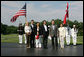 President George W. Bush and Mrs. Laura Bush welcome Prime Minister Anders Fogh Rasmussen of Denmark and his family to Camp David Friday, June 9, 2006. Pictured, from left, are the Prime Minister's daughter-in-law Kristina, son Henrik and wife Anne-Mette Rasmussen. White House photo by Shealah Craighead