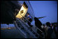 President George W. Bush boards Air Force One at Andrews Air Force Base Monday night, June 12, 2006, en route to Iraq. White House photo by Eric Draper