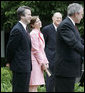 Brett and Ashley Kavanaugh and Justice Anthony Kennedy react to President George W. Bush during the Rose Garden swearing-in ceremony Thursday, June 1, 2006, for Mr. Kavanaugh to the U.S. Court of Appeals for the District of Columbia. White House photo by Eric Draper