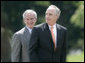 President George W. Bush invites former Idaho Gov. Dirk Kempthorne to the podium, after Kempthorne’s swearing-in ceremony as the new U.S. Secretary of Interior, Wednesday, June 7, 2006 on the South Lawn of the White House in Washington. White House photo by Eric Draper