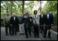 President George W. Bush, surrounded by members of his Cabinet and his national security team, talks with reporters Monday afternoon, June 12, 2006 in Camp David, Md., during the first day of a two-day meeting on Iraq. President Bush is joined by, from left to right, Chairman of the Joint Cheifs of Staff General Peter Pace, Vice President Dick Cheney, Secretary of Defense Donald Rumsfeld, Secretary of State Condoleezza Rice, Secretary of Commerce Carlos Gutierrez and Secretary of Agriculture Mike Johanns. White House photo by Eric Draper