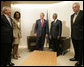 President George W. Bush stands with Kofi Annan, Secretary-General of the United Nations, after the President's arrival Tuesday, Sept. 19, 2006, to the U.N. in New York. With them are from left: Josh Bolten, White House Chief of Staff; Condoleezza Rice, Secretary of State, and Mark Malloch Brown, Deputy Secretary-General of the U.N. White House photo by Eric Draper