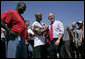 President George W. Bush shakes hands with Tampa Bay Buccaneers' running back Michael Pittman during his visit to the NFL team's training facility in Tampa, Fla., Thursday, Sept. 21, 2006. White House photo by Paul Morse