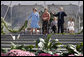 Mrs. Laura Bush joined by, left, Leone Reeder, Chair, National Fund for the U.S. Botanic Garden, and, right, Jim Hagedorn, Co-Chair, Board of Trustees, National Fund for the U.S. Botanic Garden, while the Ceremonial Garland is cut Friday, September 29, 2006, during a ceremony to celebrate the completion of the National Garden at the United States Botanic Garden in Washington, D.C. This new facility, located on a three-acre site just west of the Conservatory, will be a showcase for unusual, useful, and ornamental plants that grow well in the mid-Atlantic region. White House photo by Shealah Craighead