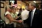 President George W. Bush visits with patrons of La Tropicana Café in Ybor City, Florida on Friday July 16, 2004. White House photo by Paul Morse