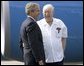 President George W. Bush chats with Freedom Corps greeter Scotty Maconochie after landing in Waterford, Michigan on Wednesday July 7, 2004. White House photo by Paul Morse