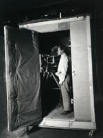 Cameraman inside soundproof camera booth