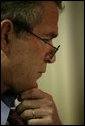 Working in the Family Theater of the White House, President George W. Bush reviews his speech the morning of his State of the Union Address Jan. 20, 2004. White House photo by Eric Draper