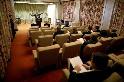 Meeting with staff in the Family Theater of the White House, President George W. Bush rehearses his State of the Union speech Jan. 19, 2004. White House photo by Eric Draper