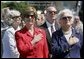 Laura Bush and Former First Lady Barbara Bush stand during the National Anthem at the National World War II Memorial on the National Mall, Saturday, May 29, 2004. White House photo by Eric Draper