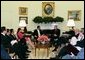 President George W. Bush meets with President Francisco Flores Perez of El Salvador in the Oval Office Thursday, May 27, 2004. White House photo by Joyce Naltchayan