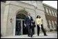 President George W. Bush and Cheryl Brown Henderson, President and CEO of Brown Foundation for Educational Equity, Excellence and Research, walk to the stage during the 50th anniversary of Brown V. Board of Education at the National Historic Site named in its honor in Topeka, Kan., Monday, May 17, 2004. White House photo by Eric Draper.