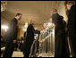 President George W. Bush welcomes Chicago White Sox players to the White House, Monday, Feb. 13, 2006 during an East Room ceremony to honor the 2005 World Series Champions. The World Series Trophy is seen foreground. White House photo by Eric Draper