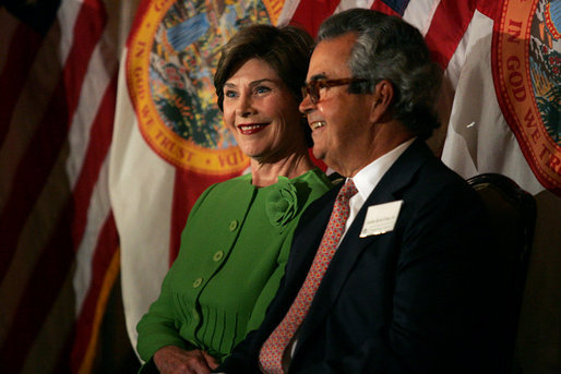 Laura Bush sits with Carlos del la Cruz, Event Host, during a Junior Ranger event Wednesday, Feb. 15, 2006, in Coral Gables, FL. The Junior Ranger programs introduces young people to America's national parks and historic sites, and is operating in 286 of the 388 National Parks across the country. White House photo by Shealah Craighead