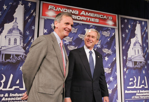 President George W. Bush stands with New Hampshire U.S. Senator Judd Gregg prior to addressing his remarks on the 2007 Budget and the Deficit Reduction Act of 2005, in a speech to the Business and Industry Association of New Hampshire, Wednesday, Feb. 8, 2006 in Manchester, N.H. White House photo by Paul Morse