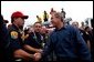 President George W. Bush greets firefighters after speaking in El Cajon, Calif., Tuesday, Nov. 4, 2003 White House photo by Eric Draper.