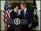 President George W. Bush congratulates NATO Secretary General Lord George Robertson after awarding him the Presidential Medal of Freedom during a ceremony in the Roosevelt Room Wednesday, Nov. 12, 2003.  White House photo by Tina Hager