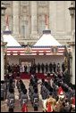 President George W. Bush and Laura Bush listen to the playing of America's national anthem during an official welcome ceremony at Buckingham Palace in London, Wednesday, Nov. 19, 2003. Standing with them are Her Majesty Queen Elizabeth and Prince Philip, Duke of Edinburgh. The President and Mrs. Bush last visited Buckingham Palace July of 2001. White House photo by Paul Morse.