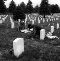Decorating a soldier's grave. . . .