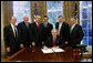 President George W. Bush prepares to sign H.R. 5683, to preserve the Mt. Soledad Veterans Memorial in San Diego, Calif., Monday, Aug. 14, 2006, at a signing ceremony in the Oval Office of the White House, which will provide for the immediate acquisition of the memorial by the United States. Joining President Bush at the signing, from left to right, Bill Kellogg, president of the Mount Soledad Association; Philip Thalheimer, chairman, San Diegans for Mt. Soledad National War Memorial; U.S. Rep. Brian Bilbray, R-Calif.; U.S. Rep. Darrell Issa, R-Calif.; U.S. Rep. Duncan Hunter, R- Calif.; and Chuck LiMandri, chief counsel, San Diegans for Mt. Soledad National War Memorial. White House photo by Paul Morse