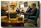 President George W. Bush meets with Director of the Office of Homeland Security Tom Ridge, Postmaster General John Potter, and President of the National Association of Letter Carriers Vince Sombratto in the Oval Office Oct. 22. White House photo by Tina Hager.