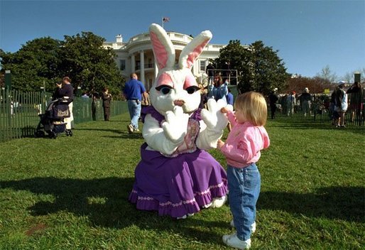 Secretary of Education Roderick Paige reads to children during on of the many story book hours at the Annual Easter Egg Roll on the South Lawn of the White House April 1, 2002. Other readers including Laura Bush, Secretary of Transportation Norm Mineta and Marc Brown, children's book author of Arthur Meets the President. File photo. White House photo by Evan Parker