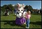 Secretary of Education Roderick Paige reads to children during on of the many story book hours at the Annual Easter Egg Roll on the South Lawn of the White House April 1, 2002. Other readers including Laura Bush, Secretary of Transportation Norm Mineta and Marc Brown, children's book author of Arthur Meets the President. File photo. White House photo by Evan Parker