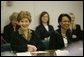 Laura Bush and Secretary of State Condoleezza Rice laugh during a roundtable discussion with women leaders from around the world held in honor of International Women's Day at the State Department in Washington, D.C. Tuesday, March 8, 2005. Today in her remarks at the State Department Mrs. Bush said, "We all have an obligation to speak for women who are denied their rights to learn, to vote or to live in freedom. We may come from different backgrounds, but advancing human rights is the responsibility of all humanity, a commitment shared by people of goodwill on every continent." White House photo by Susan Sterner