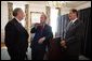 President George W. Bush talks with Canadian Prime Minister Paul Martin, left, and Mexican President Vicente Fox, right, during their March 23, 2005, trilateral meeting at Baylor University in Waco, Texas. White House photo by Eric Draper White House photo by Eric Draper