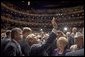 President George W. Bush waves to people in the balconies after participating in a conversation on strengthening Social Security at the Cannon Center for the Performing Arts in Memphis, Tenn., Friday, March 11, 2005. White House photo by Paul Morse