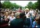 President George W. Bush comforts a woman during the Annual Peace' Officers Memorial Service at the U.S. Capitol in Washington, D.C., Thursday, May 15, 2003. 