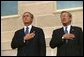 Attending the Pentagon Observance ceremony, President George W. Bush and Secretary of Defense Donald Rumsfeld say the Pledge of Allegiance before speaking Tuesday, Sept. 11. White House photo by Eric Draper.