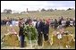 President George W. Bush and Mrs. Laura Bush participate in a wreath-laying ceremony near the site of the crash where seven crew members and 33 passengers died when the plane crashed in Somerset County. Officials believe the plane was heading for a target in Washington, D.C., when the passengers fought back against the four hijackers. White House photo by Tina Hager.