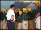 President George W. Bush greets players and coaches from the Valley Sports American Little League, this year’s Little League World Series Champions, upon arrival at Louisville International Stanford Field Airport in Kentucky Thursday, September 5, 2002. 