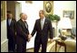 President George W. Bush welcomes Australian Prime Minister John Howard to the Oval Office Monday, Feb. 10, 2003. After meeting privately, the two leaders held a joint press conference in which they discussed disarmament in Iraq. White House photo by Paul Morse