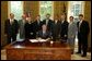 President George W. Bush signs S. 342, the Keeping Children and Families Safe Act of 2003, in the Oval Office Wednesday, June 25, 2003. The act reauthorizes the Child Abuse Prevention and Treatment Program and other related programs. White House photo by Susan Sterner.